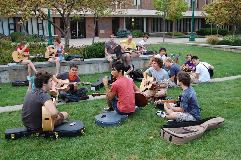 Students playing guitars