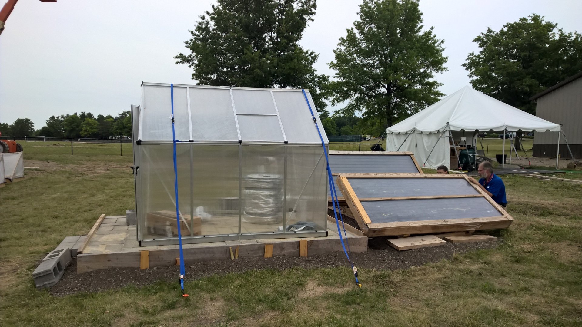 The greenhouse set up next to the collector.