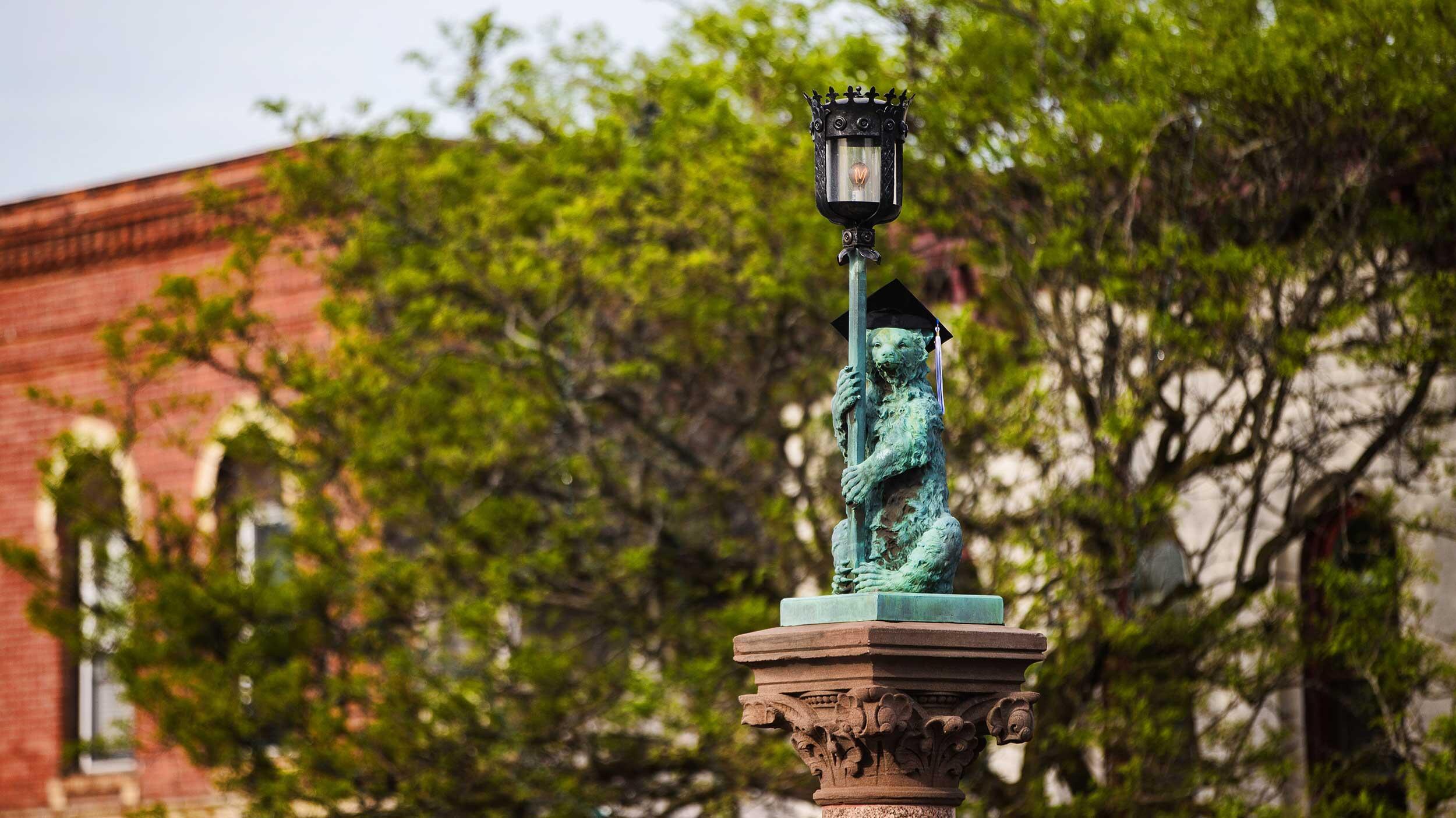 bear fountain with graduation cap