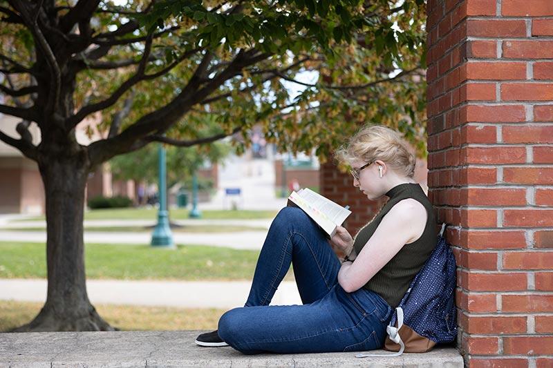 student with book