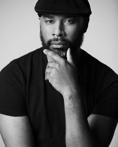 Image of Mark Broomfield in a black tshirt and cap