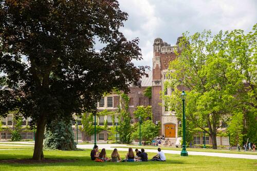 Students gather in a circle in the Sturges Quad