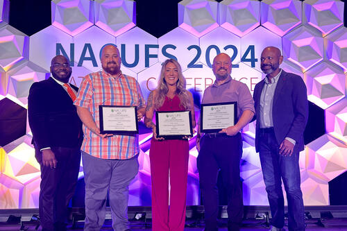 CAS Head Chef Matthew Kershner, Head Chef Oriana Van Buren, and General Manager Keith Rosengren accept 2024 NACUFS Nutrition and Loyal E. Horton Dining Awards.