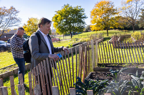 Carter Strickland looks at something in the eGarden