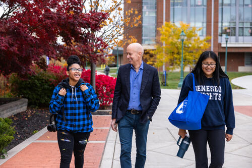 David Klein with two students.