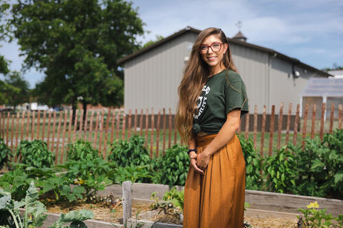 Lauren Goulet, class of 2022, stands in the eGarden.