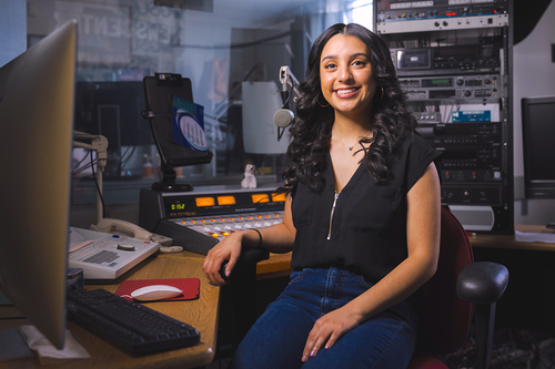 Student in radio station production room