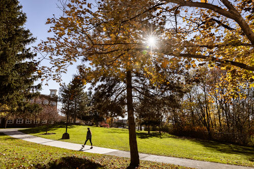 A student walks by the School of Business