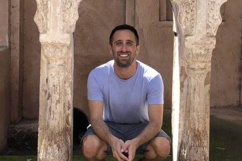 Jordan Daniel '11 poses in front of a building in Varanasi, India. (Photo submitted)