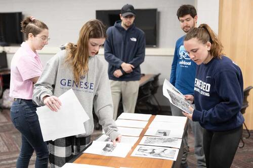 students laying out journal pages