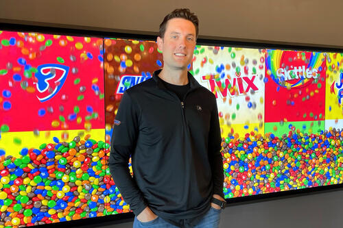 Martin Terwilliger in front of candy logos