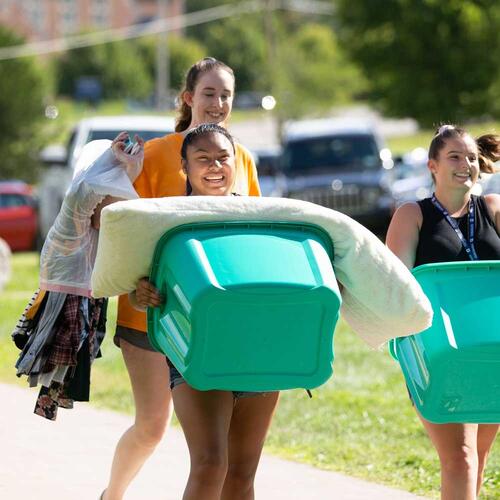 students carring boxes