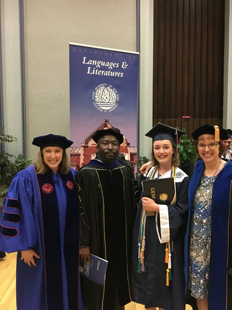 Faculty with banner